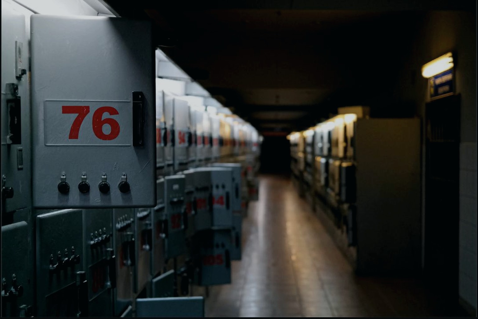 Corridor of numbered electrical and control cabinets