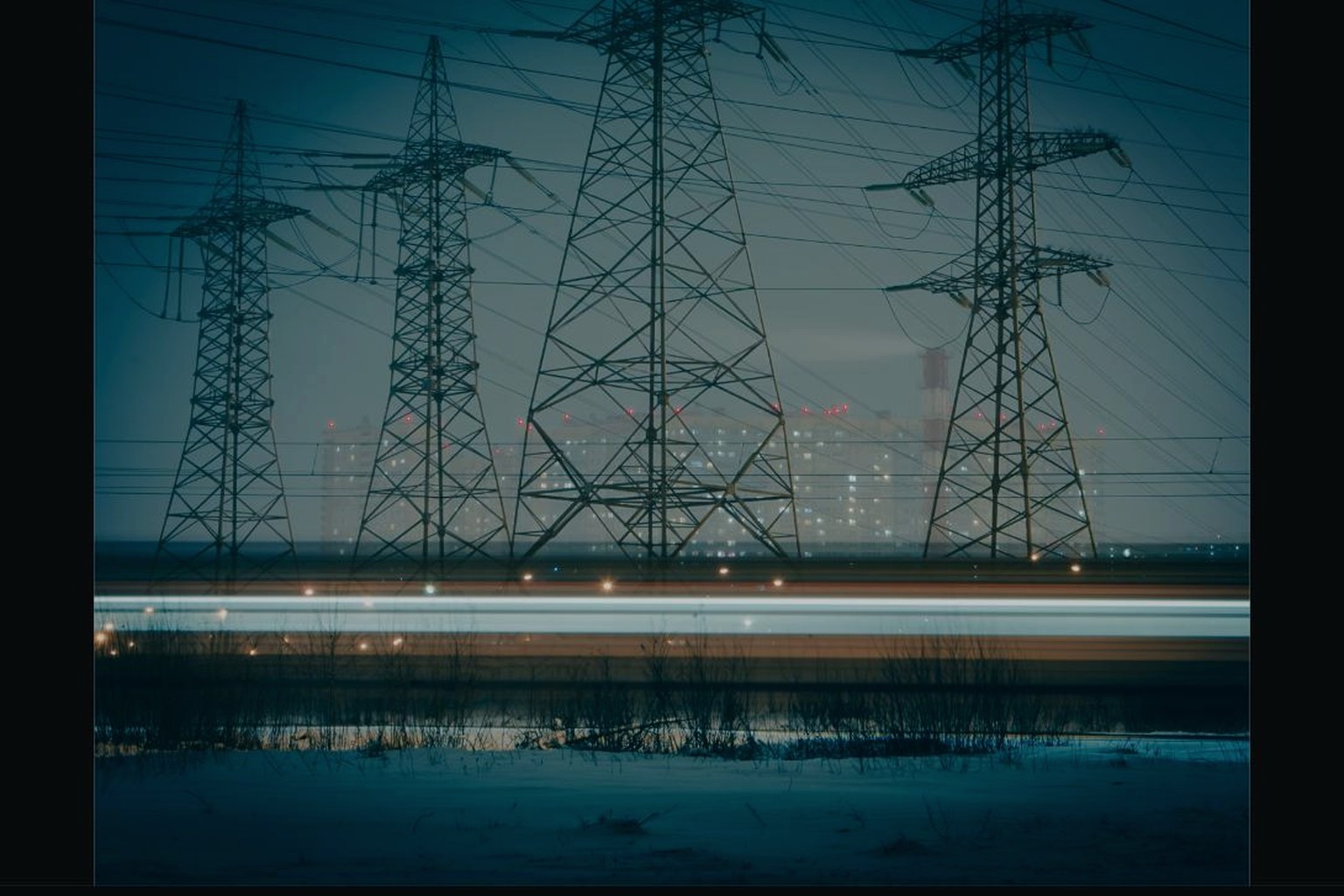 Power transmission towers at dusk