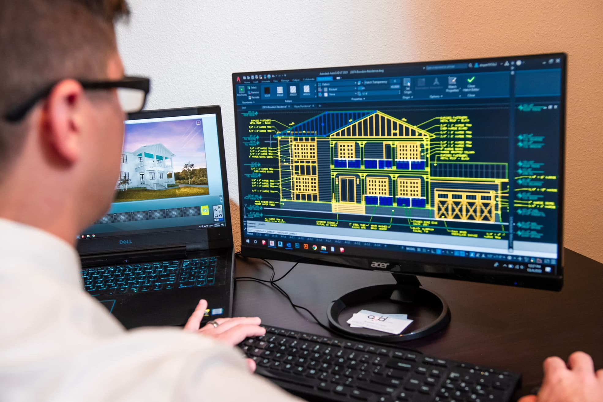 Engineer viewing a 3D building model on a monitor